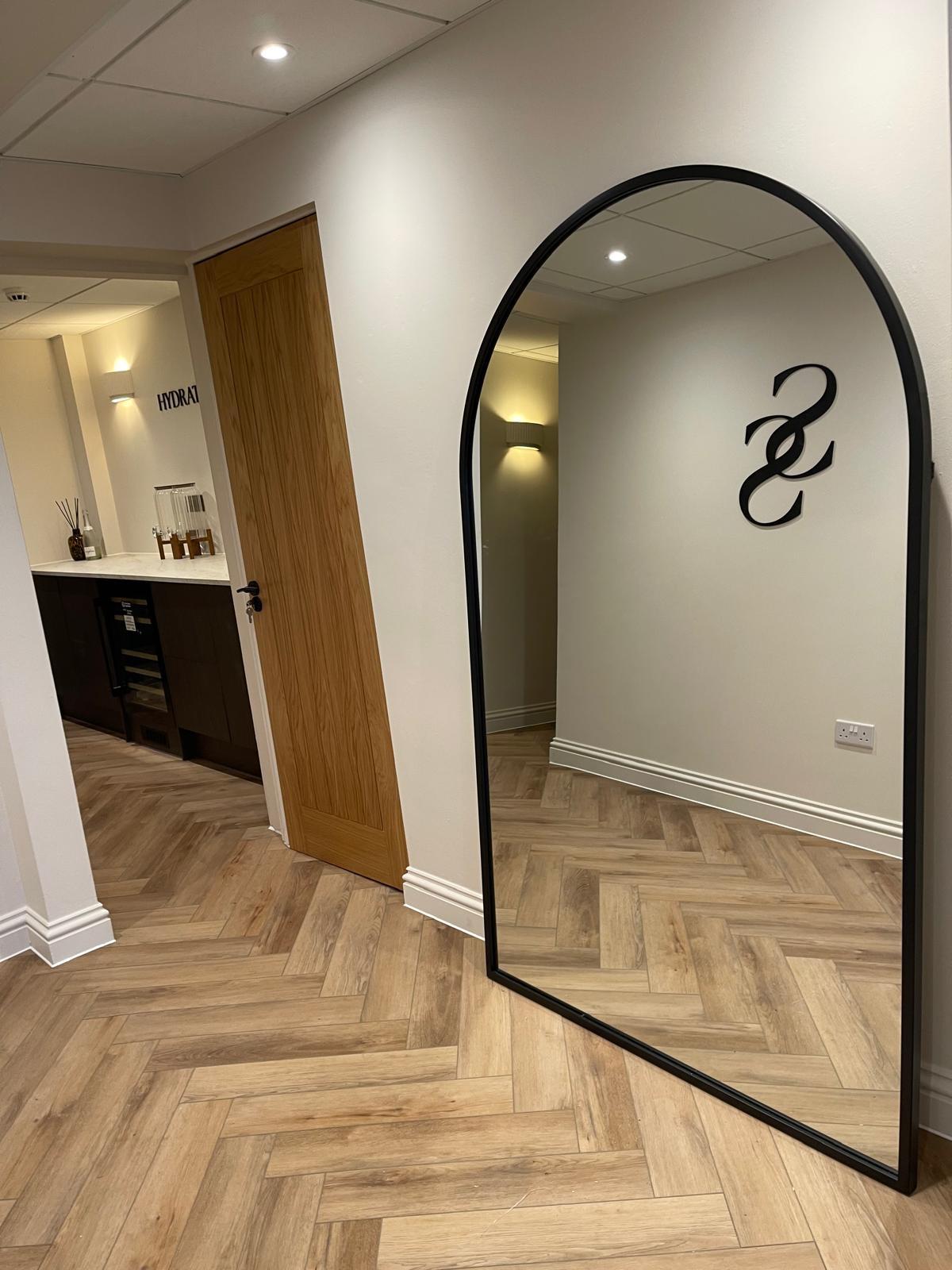 The arched mirror in the Sorella & Soul hallway